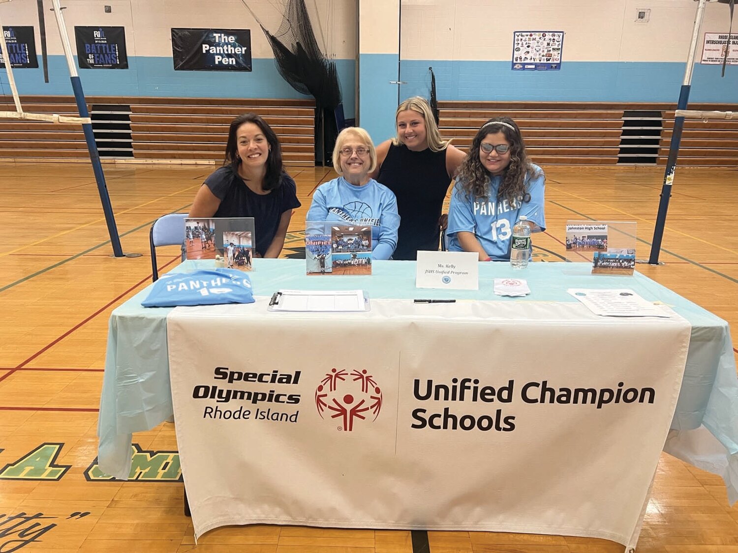 Julie Giorgi, Kathy Kelly, Savannah Bissitt, and Alexis Rivera promote the JHS unified program at the high school’s freshman orientation.
